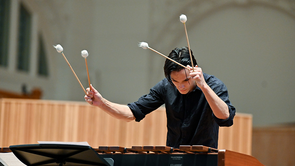 Student playing marimba